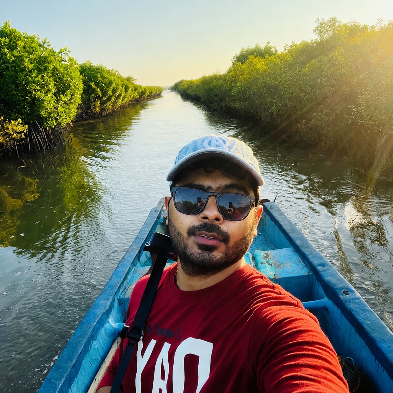 Bansi Dath Maddali, on a boat in a mangrove channel